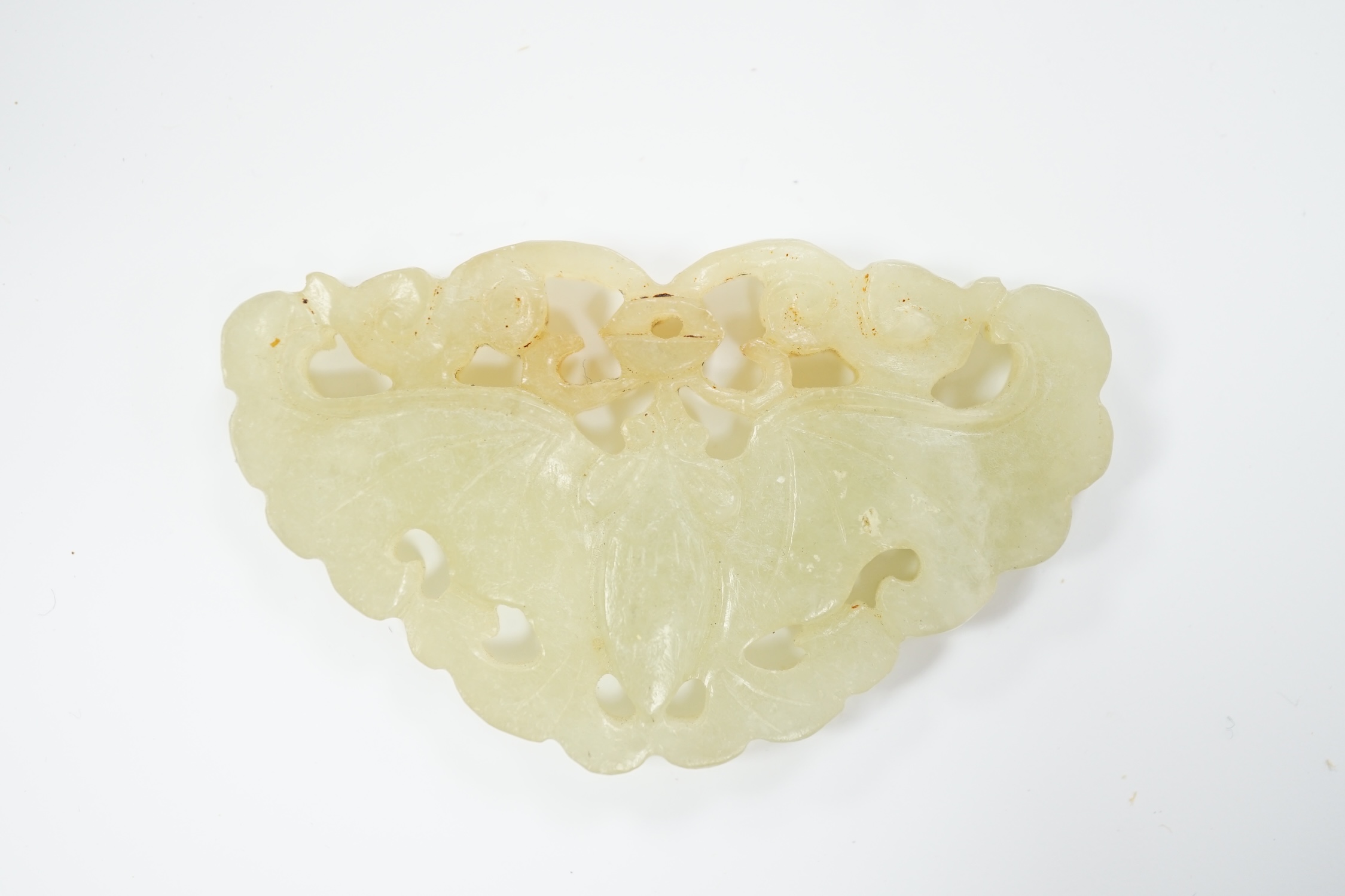 A Chinese carved jade plaque, 5.2cm wide